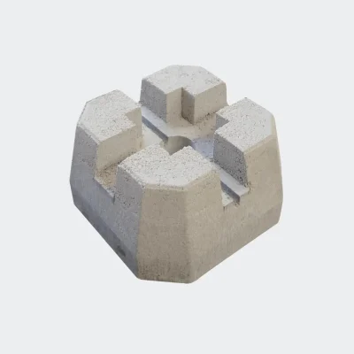 Bloc de béton monolithique 12 po x 12 po x 12 po posé sur gravier vue extérieure