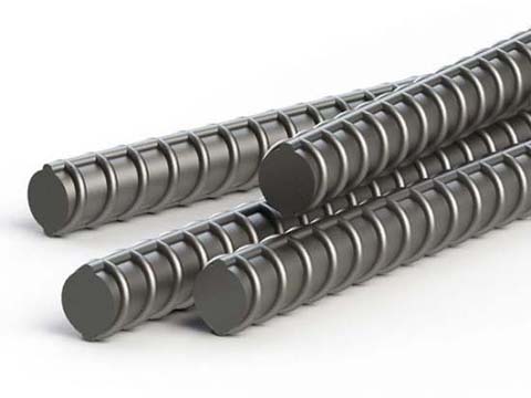 Armature en composite 1/2 po 20 pi photographiée sur fond industriel avec mise au point sur la surface striée