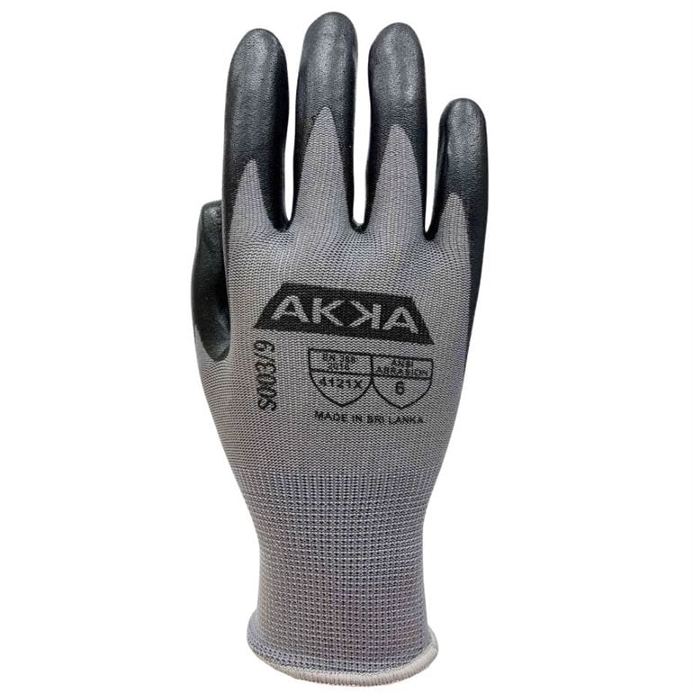 Gant en polyester gris modele G9 enduit de caoutchouc photographie sur fond neutre avec mise au point sur la surface texturée